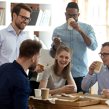 A group of happy new employees enjoying their break together