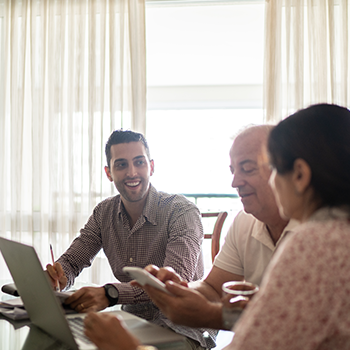 A happy plan member discussing senior discount programs with his parents